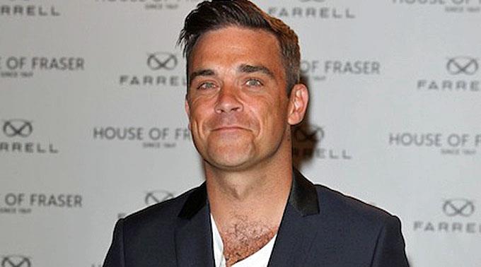 Robbie Williams liess seine Tochter Teddy in einem Tattoo auf seinem Unterarm verewigen.